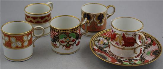 Five Worcester gilt and polychrome porcelain coffee cans and a saucer, c.1800-1820, coffee can 6.3cm, saucer 14.7cm